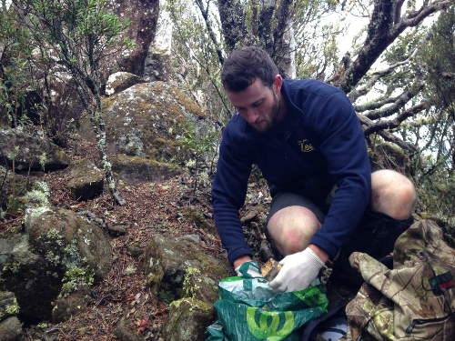 Jeff replenishing the bait stations with peanut butter, fish, oats & dried meat