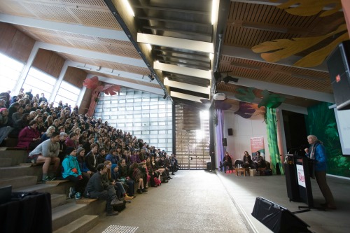 Dr Jane Goodall speaking about the global Roots & Shoots programme to a large gr