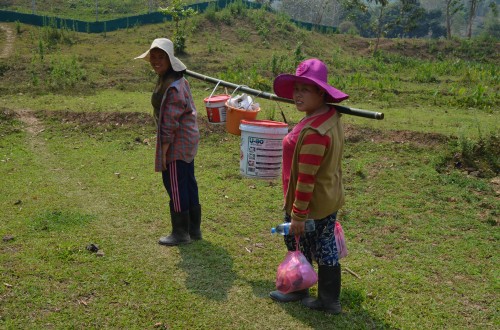 Keepers carrying some of the bear food to one of the bear houses