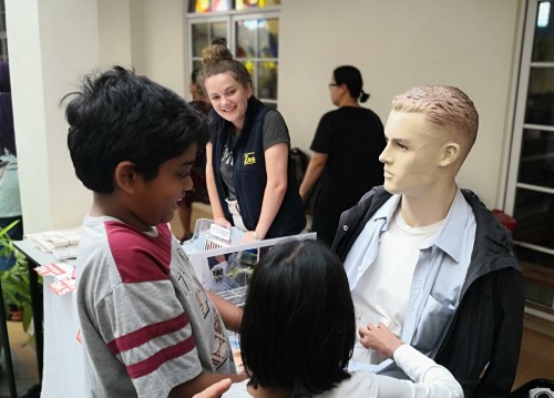 Claudia with children searching Aloysius the smuggler for contraband goods